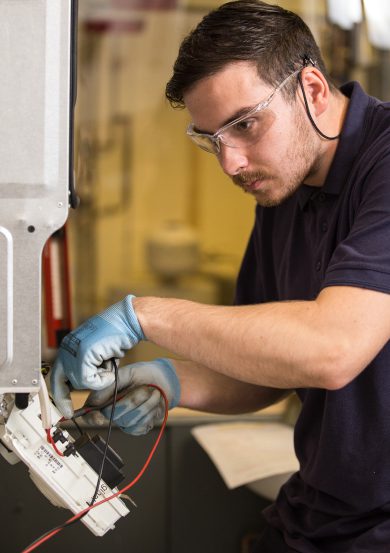 student working on boiler during their gas course