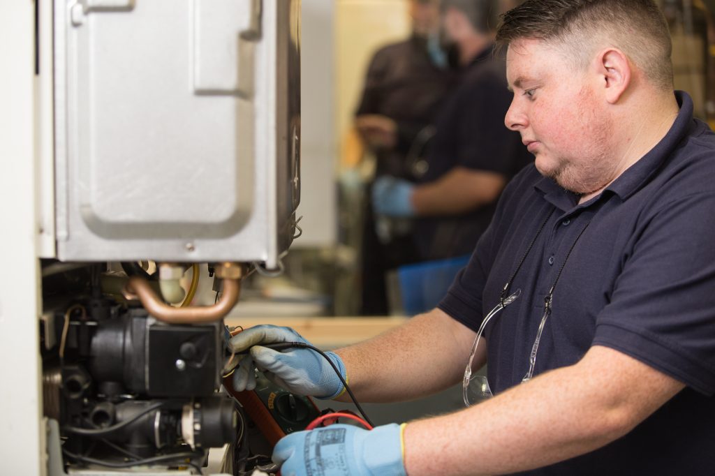 student being trained on gas boiler fault finding