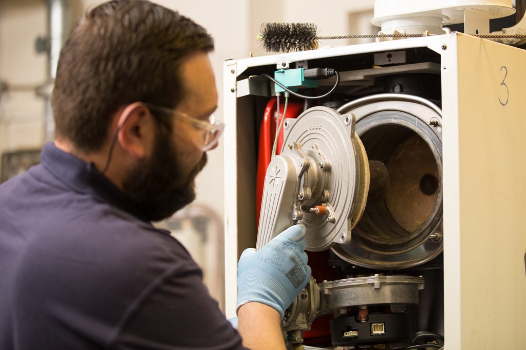 student undertaking gas boiler service training