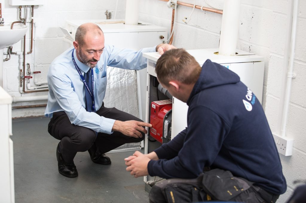 our training teaching a student on an oftec oil course