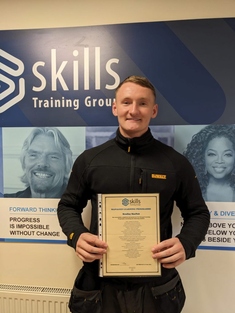 a gas trainee with his certificate