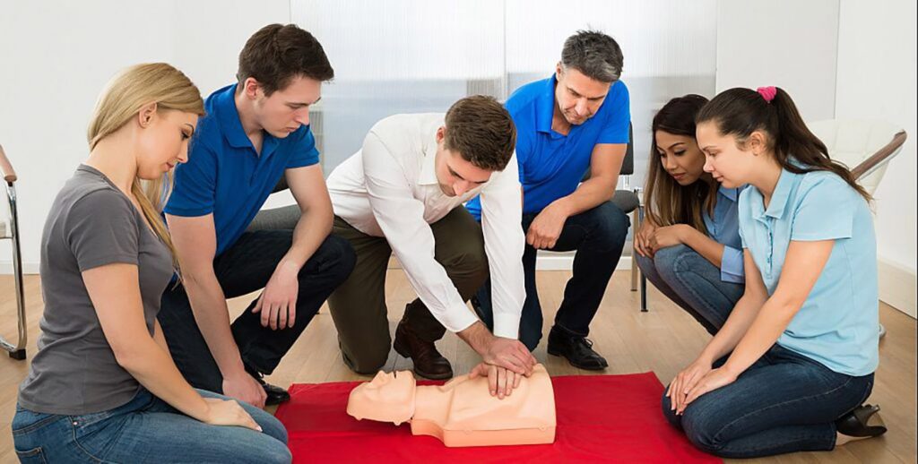 first aid trainer performing cpr