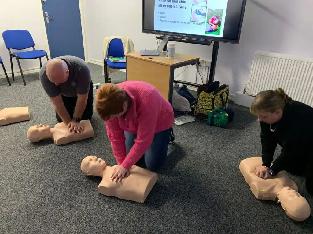 Learners practising first aid together