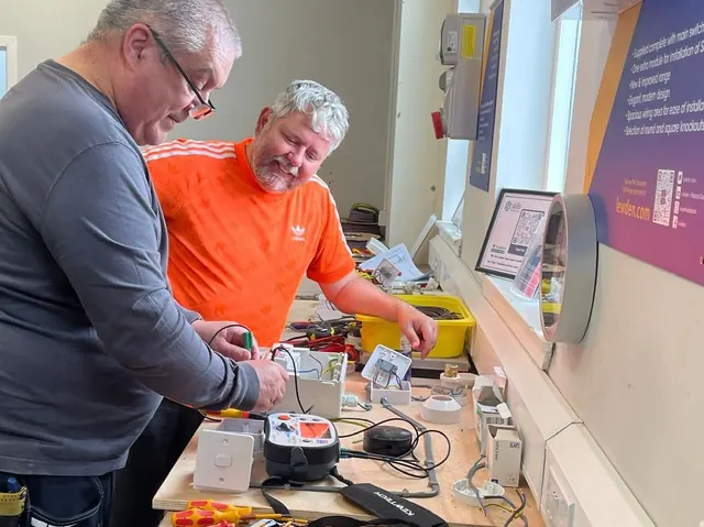 PAT Testing Course (1 Day) 1 Two people working through practical PAT testing with electrical equipment