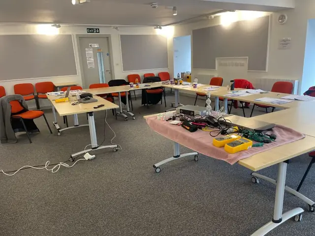 A classroom set up with practical PAT testing equipment